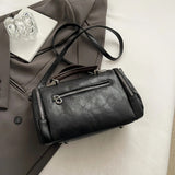 Women Bag multi-pocket design tassel and metal accents, black