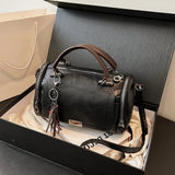Women Bag multi-pocket design tassel and metal accents, black