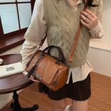 Women Bag multi-pocket design tassel and metal accents, black