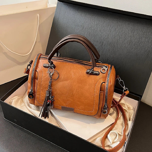 Women Bag multi-pocket design with tassel and metal accents, supports multiple carrying methods, combining practicality and style..light brown